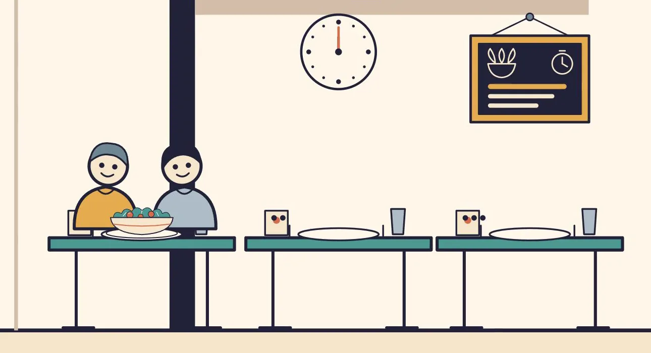 Two smiling customers share a salad at a restaurant table, next to empty tables, a clock and a menu board.
